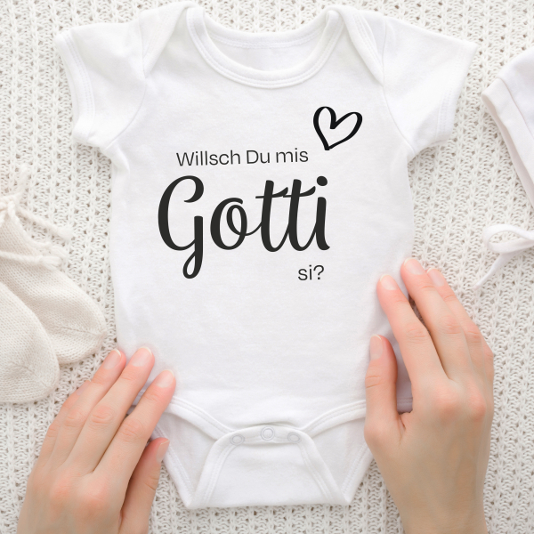 Willsch Du mis Gotti si?   Dieser Babybody mit ganz viel Herz. Und natürlich mit der Frage aller Fragen: Willst Du mein Gotti sein? Der Name Gotti bedeutet auf Schweizerdeutsch die Patentante. Mit diesen bedruckten Baby Bodies kannst Du bereits vor der Ge