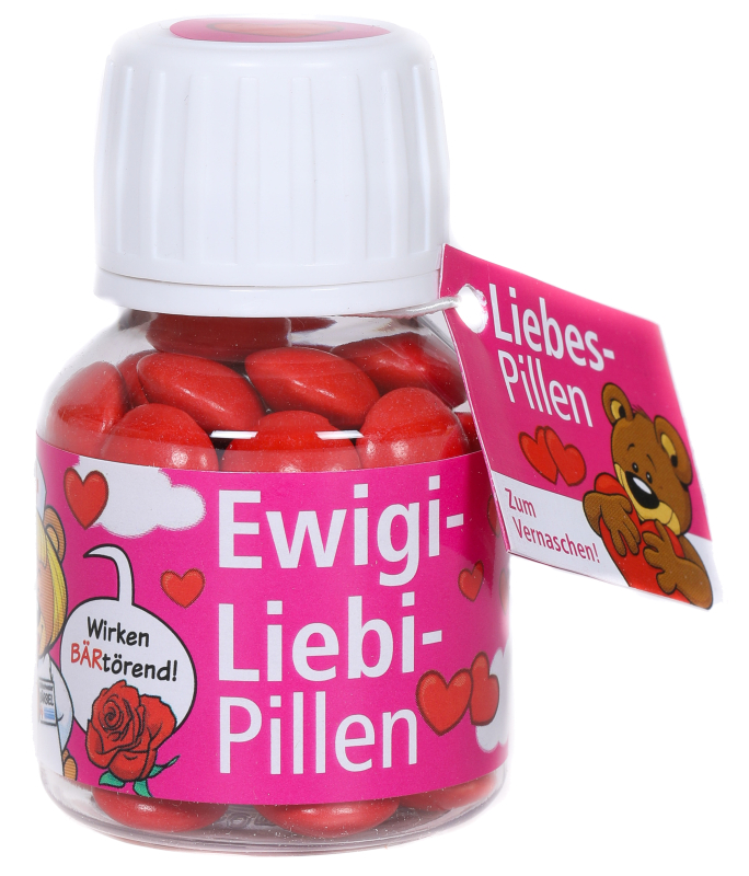 Ewigi-Liebi-Pillen. Eine Süssigkeit soll die ewige Liebe bringen. Bis zur Hochzeit und noch viel länger. Die besondere Liebespille.  Die feinen Schokoladenpillen mit dem lustigen Spruch auf Schweizerdeutsch. Ein Aufsteller für Frauen und Männer. Eine witz